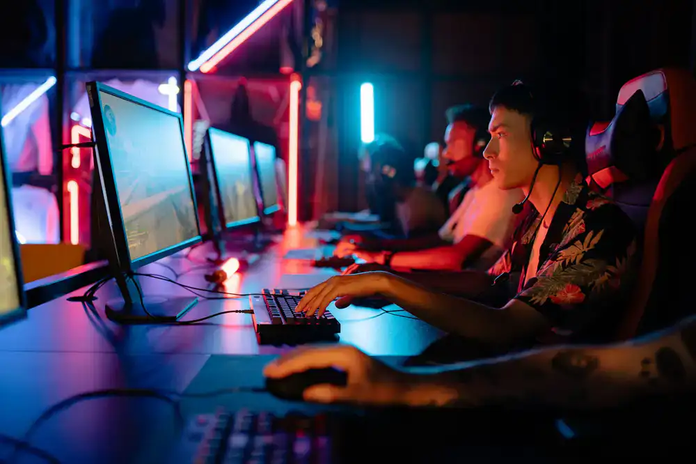 Two players analyzing match footage on a monitor